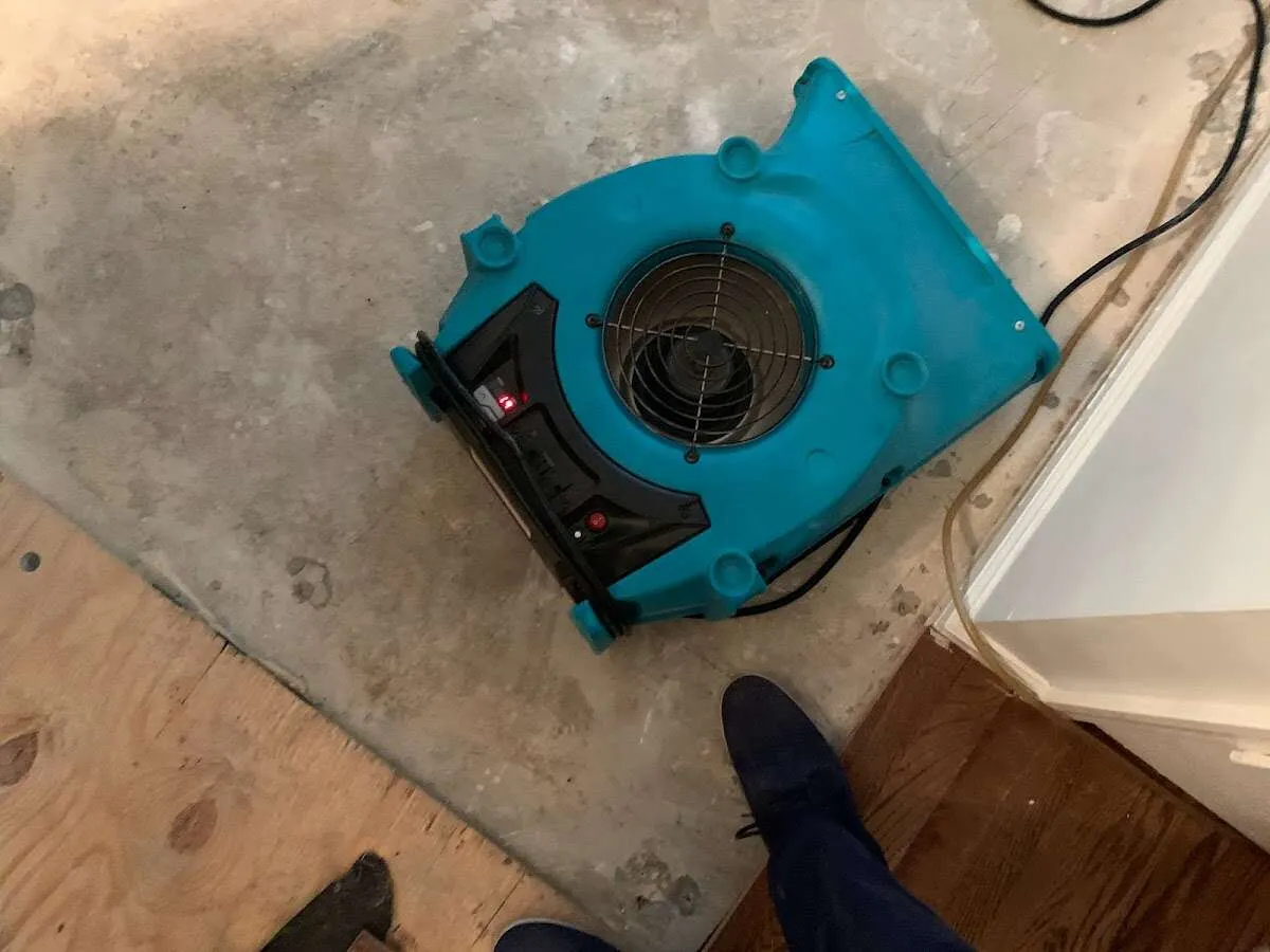 Air mover drying subfloor during Leak Detection & Repair in Unity